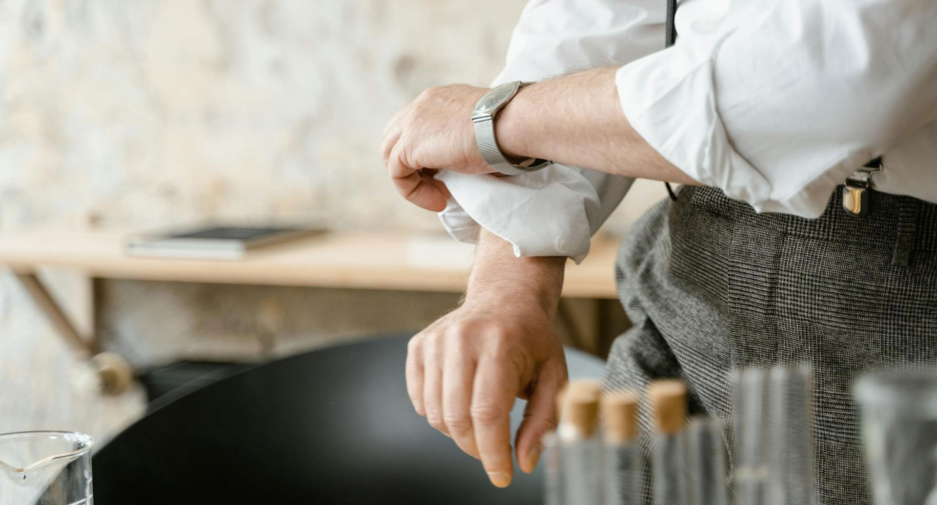 Image of man rolling up his sleeves.